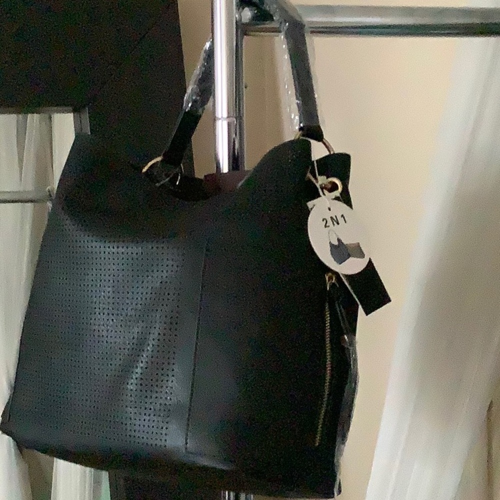 Black faux leather shoulder bag with makeup bag included